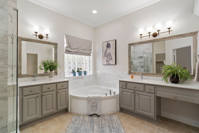 full bathroom featuring a bath, a stall shower, two vanities, and a sink