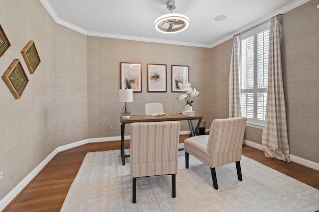 office area with wallpapered walls, baseboards, wood finished floors, and ornamental molding