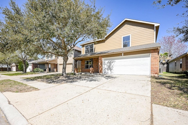 traditional-style home featuring concrete driveway, a garage, and brick siding