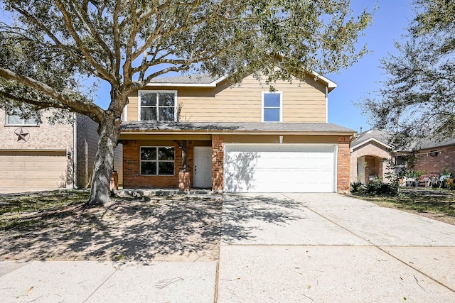 traditional-style home featuring brick siding, driveway, and an attached garage