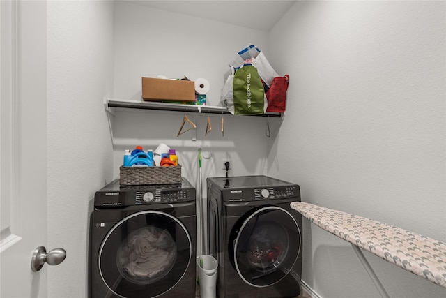 clothes washing area with laundry area and separate washer and dryer