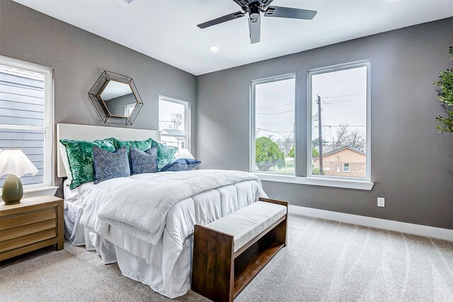 bedroom featuring ceiling fan, carpet, and baseboards