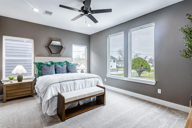 bedroom with baseboards, visible vents, a ceiling fan, carpet floors, and recessed lighting