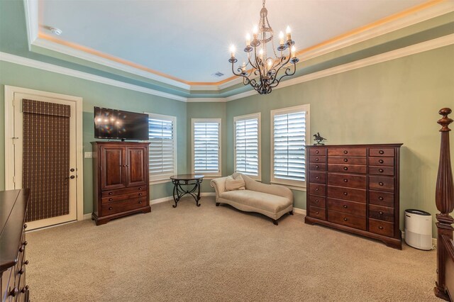 sitting room with a tray ceiling, carpet, visible vents, and crown molding