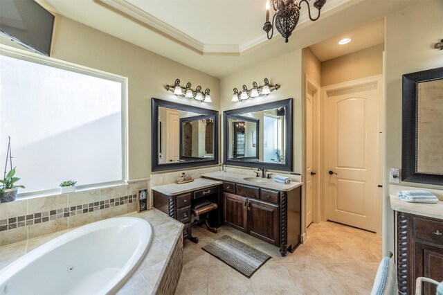 bathroom featuring tile patterned floors, a jetted tub, ornamental molding, and vanity