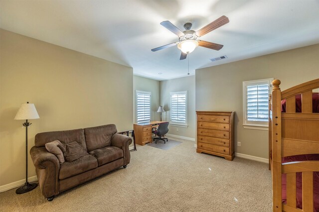 living room with ceiling fan, carpet, visible vents, and baseboards