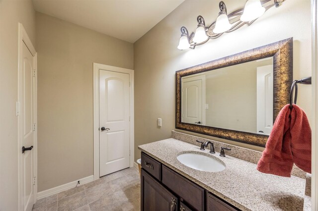 bathroom featuring vanity and baseboards