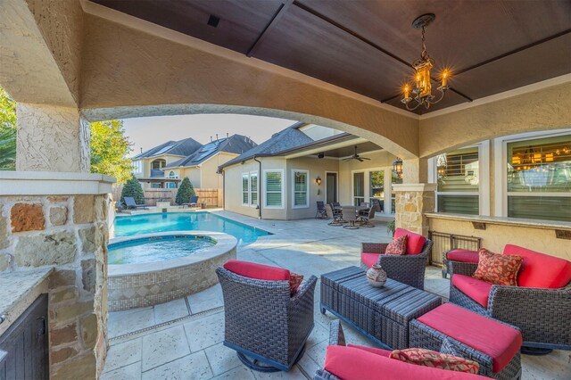 outdoor pool featuring outdoor dining area, a patio, an in ground hot tub, and an outdoor hangout area