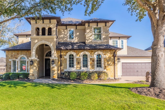 mediterranean / spanish-style house featuring stucco siding, an attached garage, concrete driveway, and a front lawn