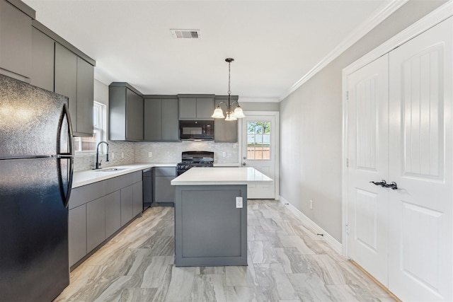 kitchen with gray cabinetry, a sink, visible vents, black appliances, and tasteful backsplash