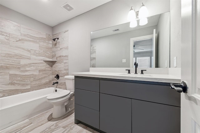 full bathroom featuring toilet, shower / washtub combination, vanity, and visible vents