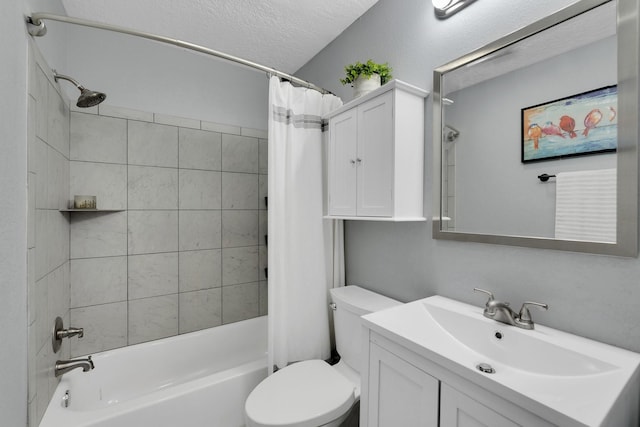 bathroom with shower / bath combination with curtain, a textured ceiling, toilet, and vanity