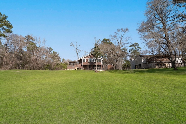 view of yard featuring a wooden deck