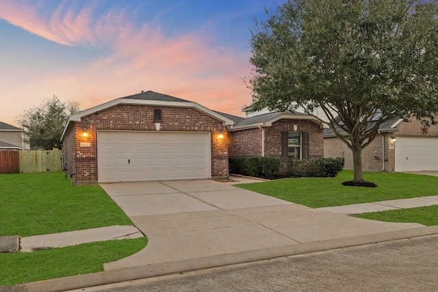 ranch-style home featuring concrete driveway, brick siding, a yard, and an attached garage