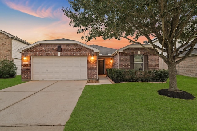 ranch-style house with a garage, driveway, brick siding, and a lawn