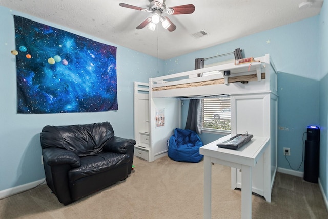 carpeted bedroom featuring baseboards, visible vents, and ceiling fan