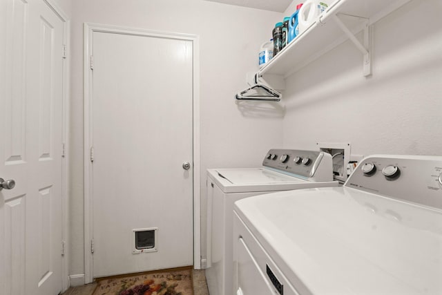 laundry area with laundry area and washer and clothes dryer