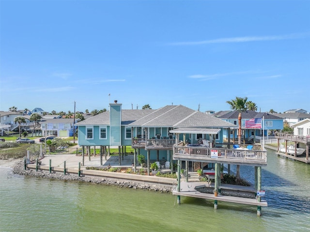 dock area featuring a residential view and a water view