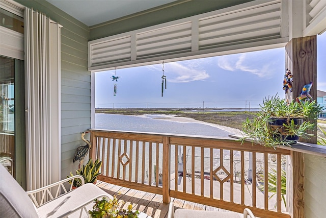 wooden terrace with a water view