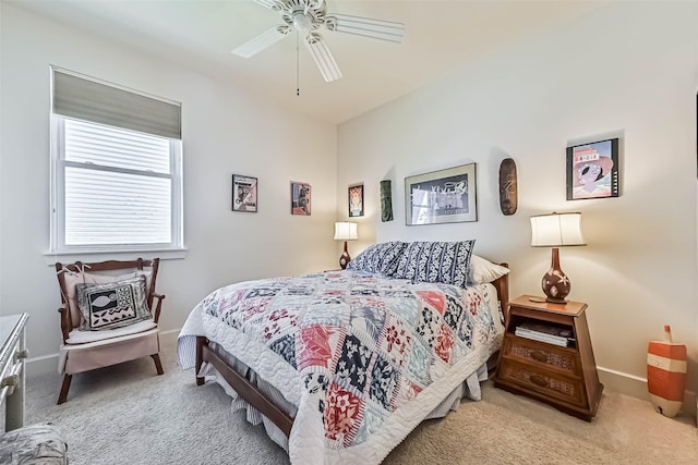 carpeted bedroom featuring a ceiling fan and baseboards