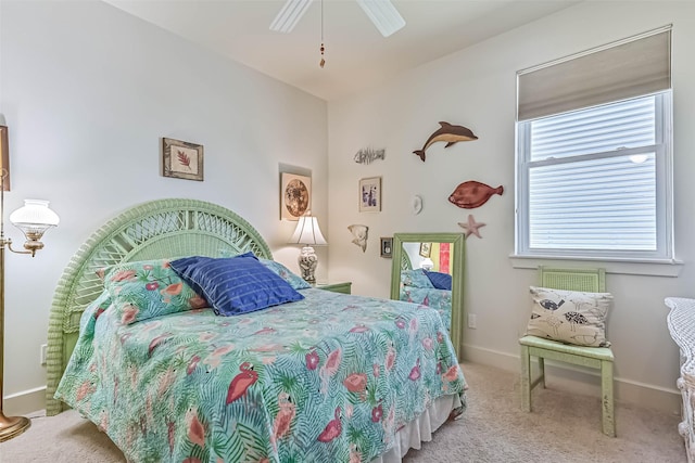 bedroom featuring carpet, baseboards, and a ceiling fan