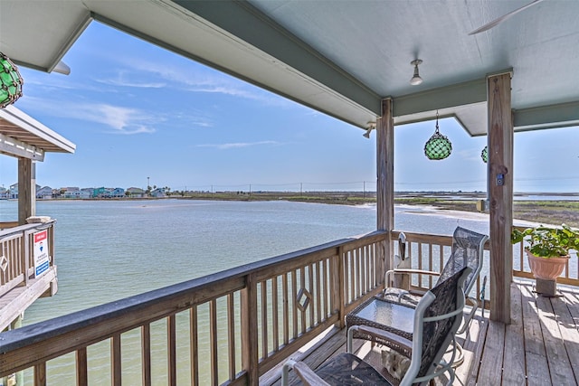 wooden deck with a water view