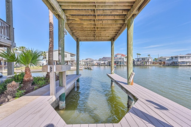 view of dock featuring a water view and boat lift