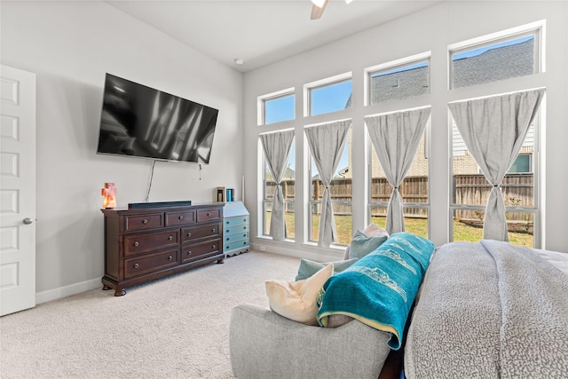 carpeted living room featuring baseboards