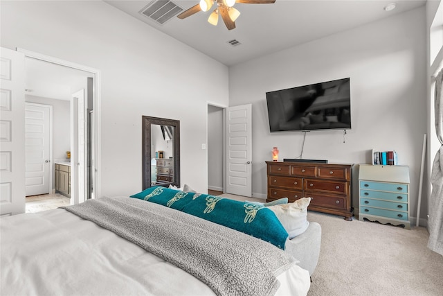 bedroom with ceiling fan, carpet, connected bathroom, and visible vents