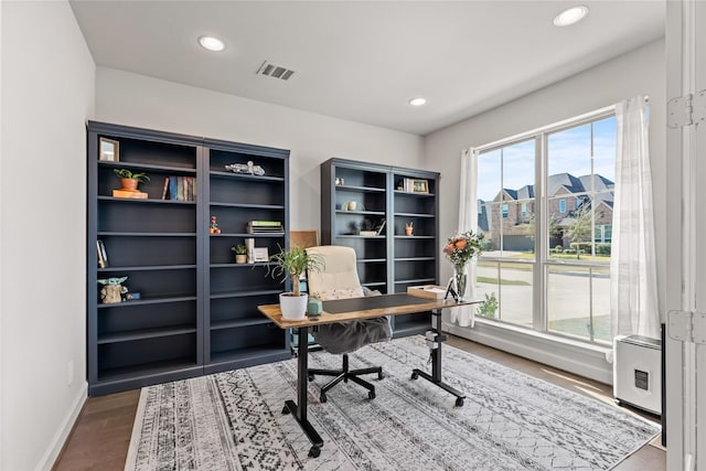 office area with baseboards, visible vents, wood finished floors, and recessed lighting