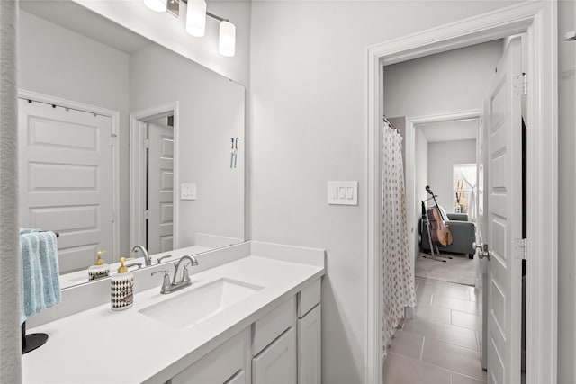 bathroom with vanity and tile patterned floors