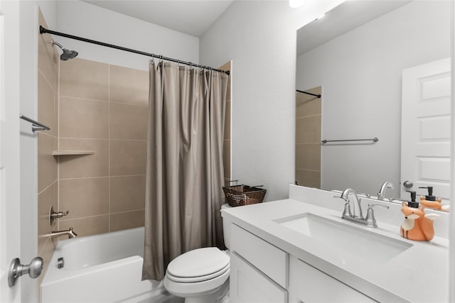 full bathroom featuring vanity, shower / bath combo with shower curtain, and toilet