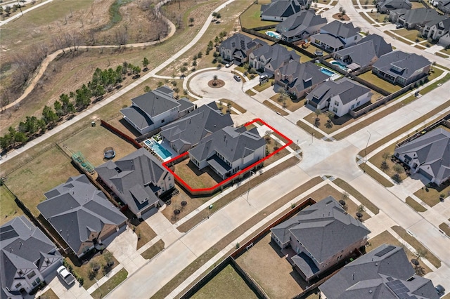 birds eye view of property with a residential view