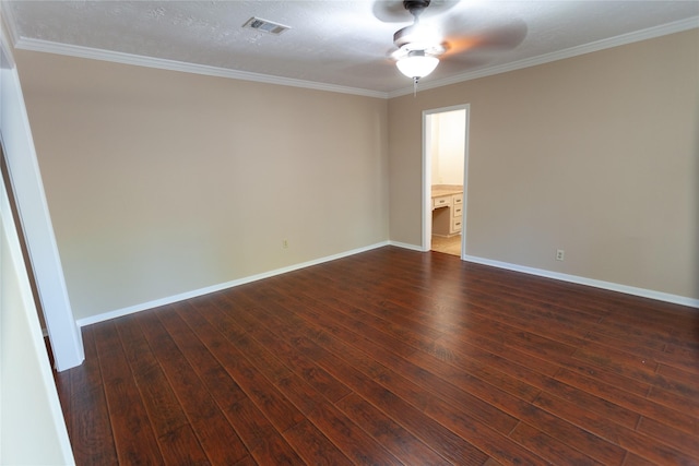 empty room with dark wood-style floors, visible vents, ceiling fan, and baseboards