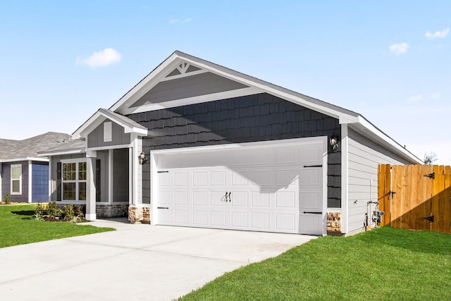 view of front facade with a front yard, stone siding, driveway, and fence