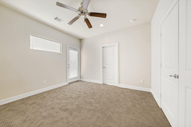 unfurnished bedroom featuring carpet, visible vents, baseboards, and recessed lighting