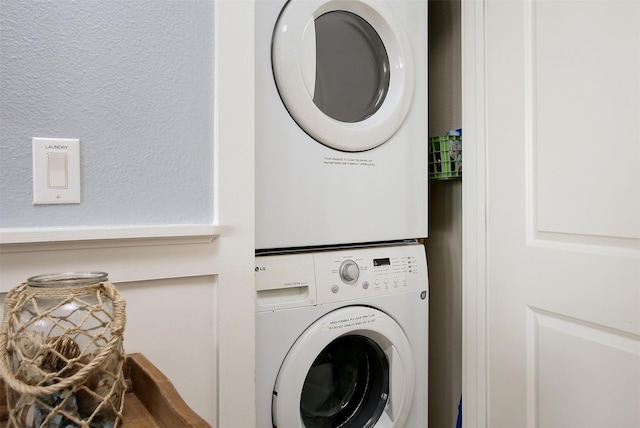 laundry room with stacked washer and clothes dryer