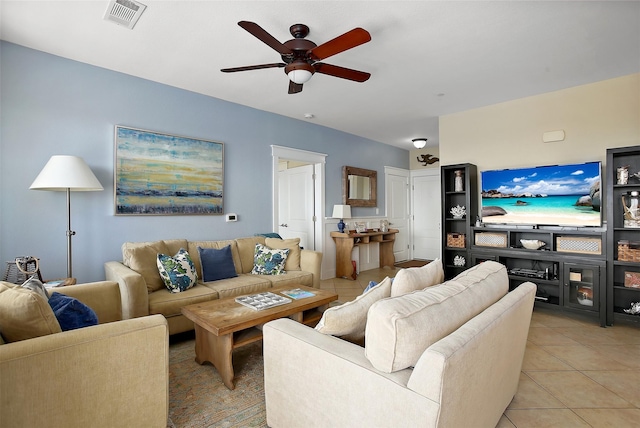 living area with light tile patterned flooring, visible vents, and a ceiling fan