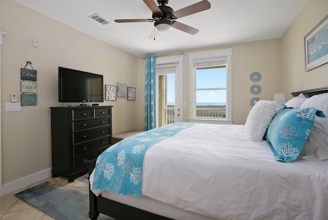 bedroom featuring access to exterior, visible vents, ceiling fan, baseboards, and light tile patterned floors