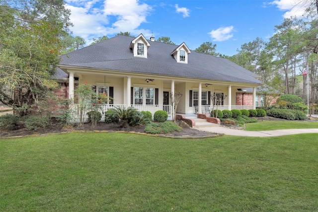 view of front of house with a porch and a front lawn