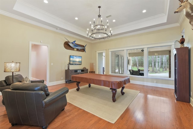 recreation room featuring baseboards, light wood-style floors, a tray ceiling, and billiards