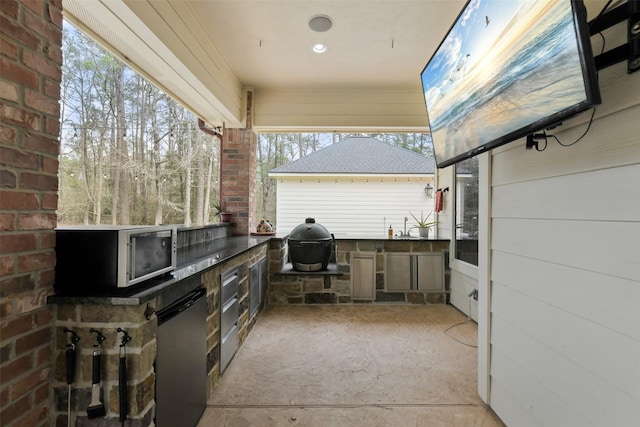 view of patio with area for grilling and grilling area