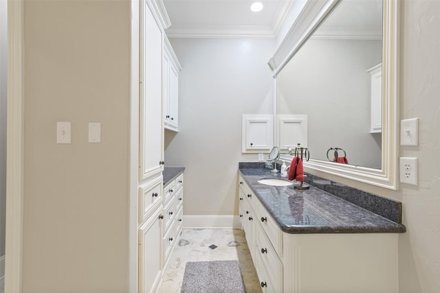 interior space featuring baseboards, recessed lighting, a sink, crown molding, and marble finish floor