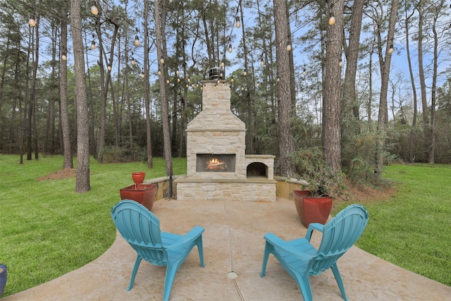 view of patio featuring an outdoor stone fireplace