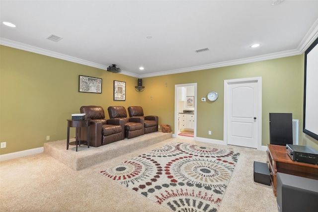 home theater room with crown molding, carpet flooring, baseboards, and visible vents