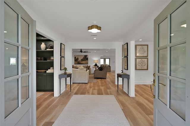 interior space with light wood-style floors, recessed lighting, and visible vents