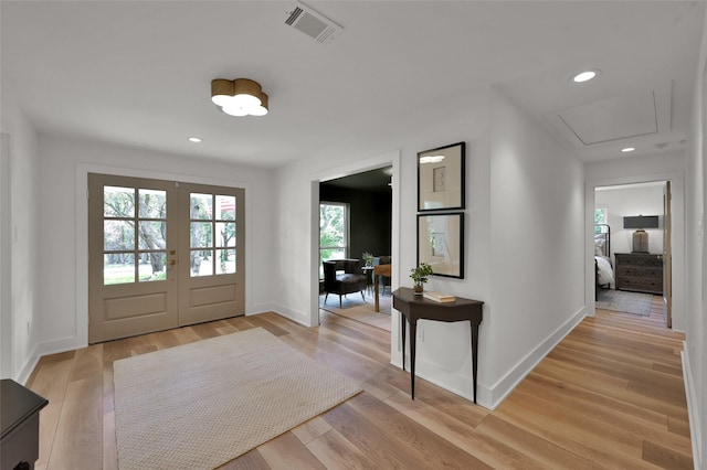 interior space featuring french doors, recessed lighting, visible vents, light wood-style flooring, and baseboards