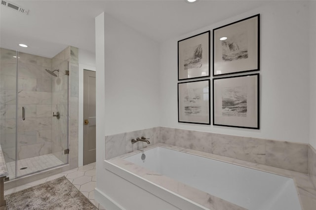 full bathroom with a shower stall, visible vents, a bath, and tile patterned floors