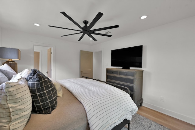 bedroom featuring light wood-type flooring, ceiling fan, baseboards, and recessed lighting