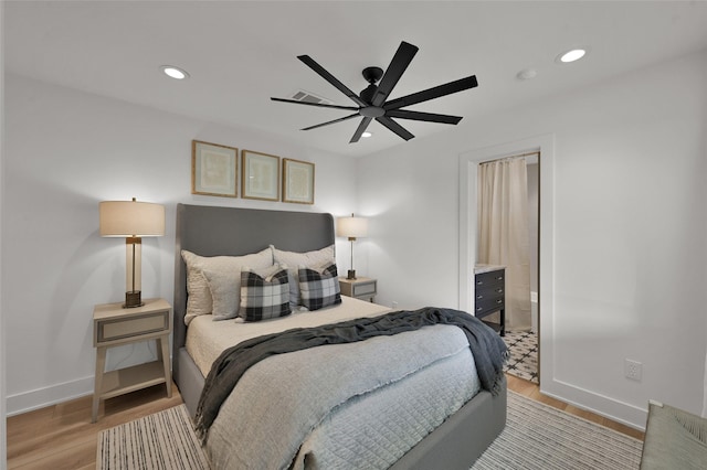 bedroom featuring light wood-style floors, visible vents, baseboards, and recessed lighting